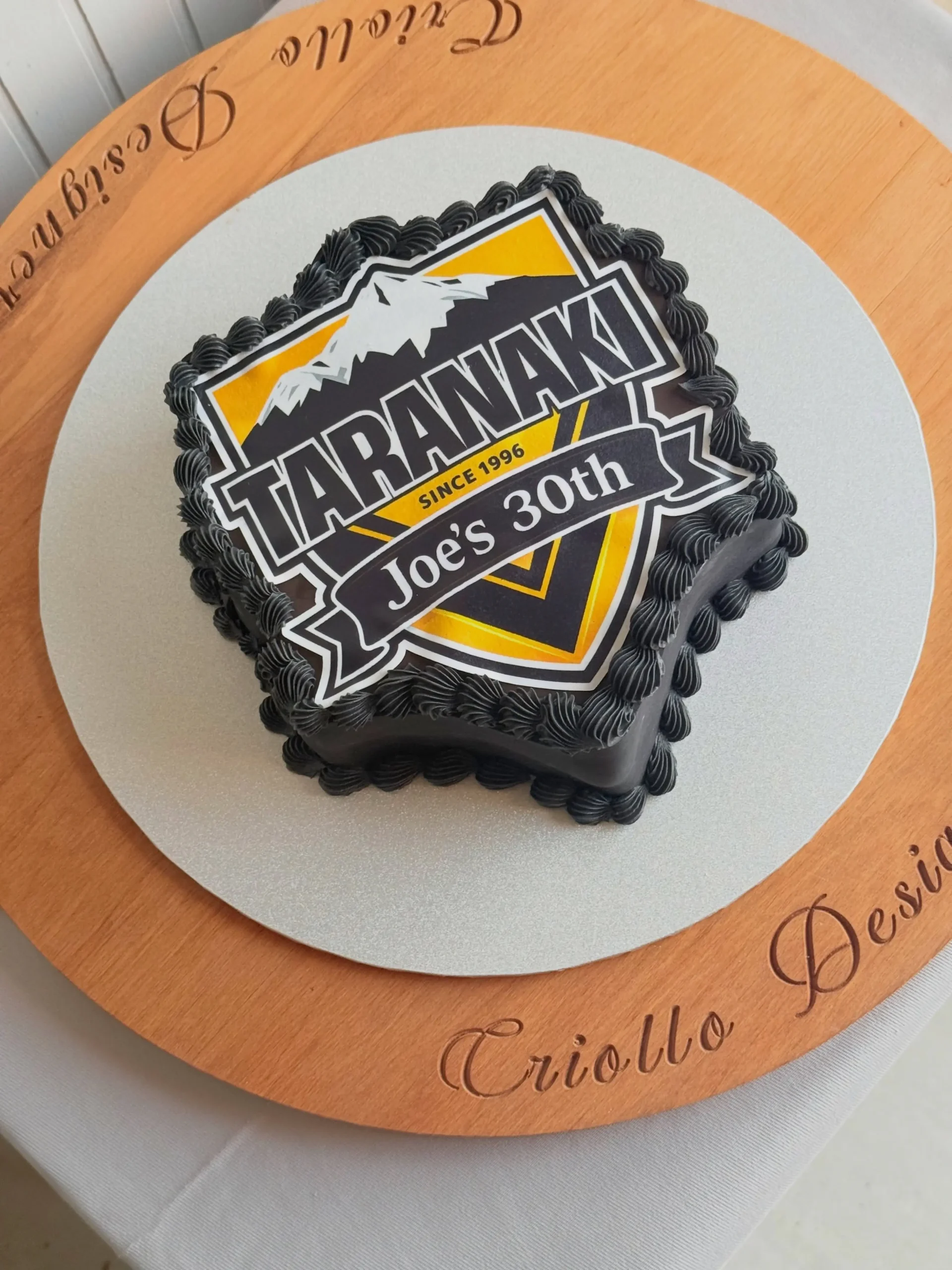 Edible logo custom cake in Dunedin by Criollo Designer Cakes