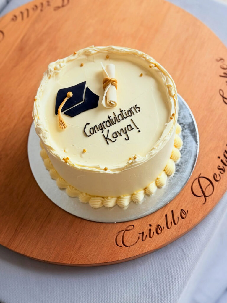 Classic White Cap and Diploma Graduation Cake by Criollo Designer Cakes in Dunedin, Otago
