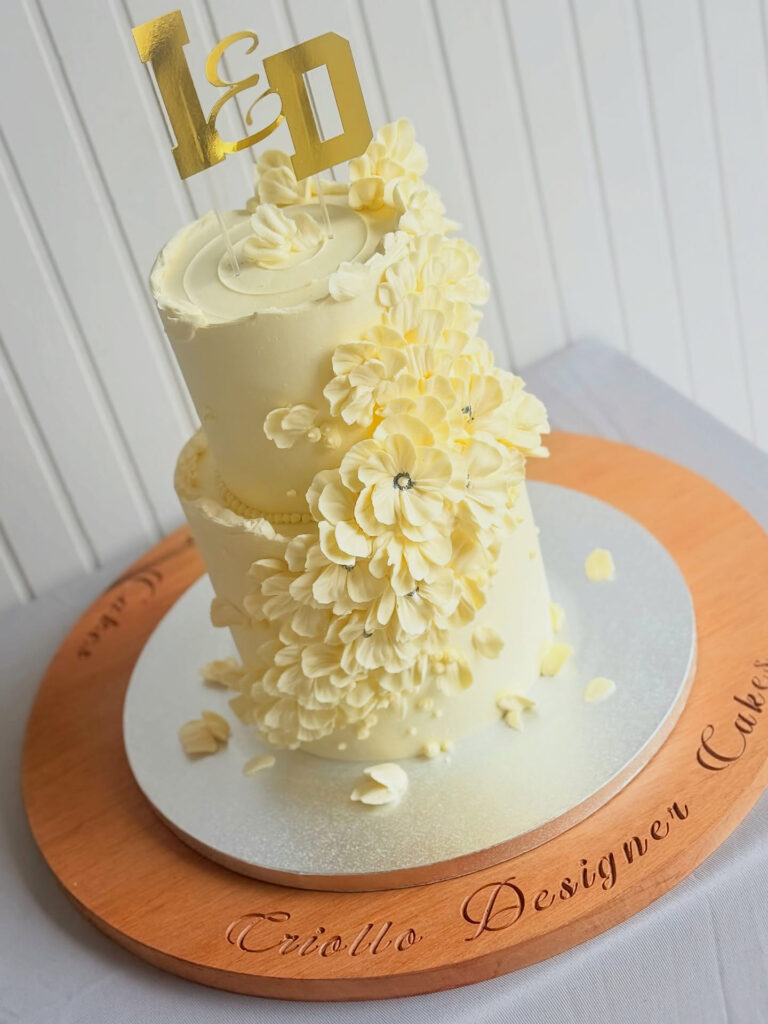 Ivory Cascading Sugar-Flower Two-Tier Wedding Cake by Criollo Designer Cakes in Dunedin, Otago