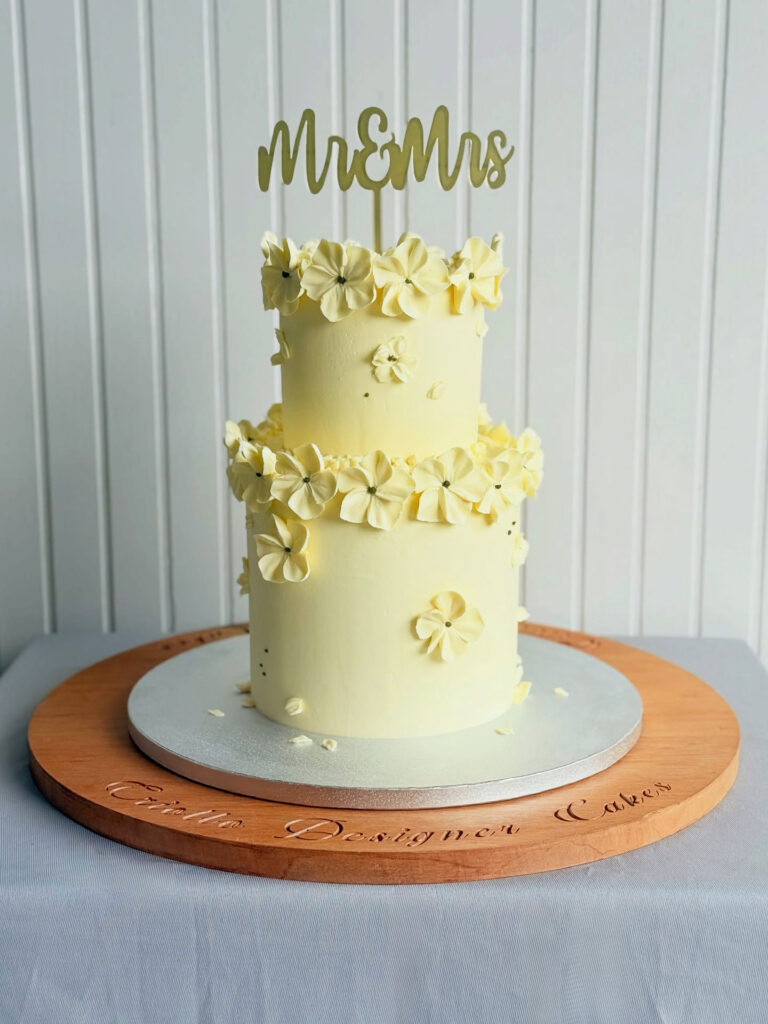 Ivory Flower-Garland Two-Tier Wedding Cake Front View by Criollo Designer Cakes in Dunedin, Otago