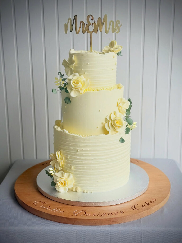 Ivory Ridged Three-Tier Floral Wedding Cake by Criollo Designer Cakes in Dunedin, Otago
