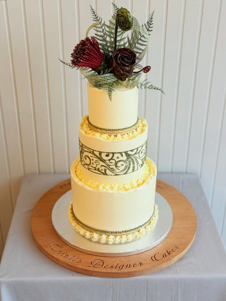Māori-Inspired Native Floral Three-Tier Wedding Cake Close View by Criollo Designer Cakes in Dunedin, Otago