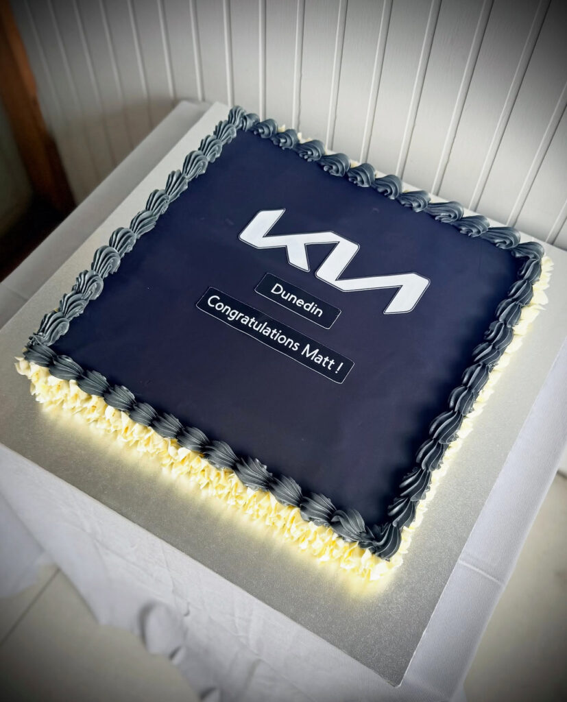 Navy Kia Congratulations Corporate Logo Cake by Criollo Designer Cakes in Dunedin, Otago