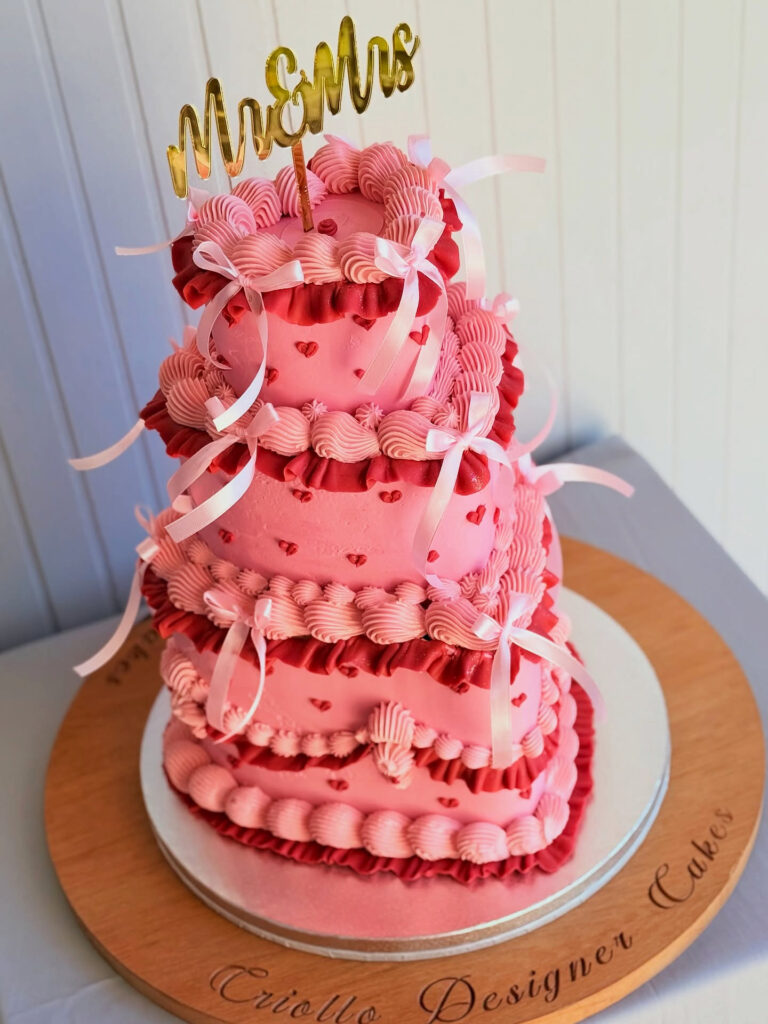Pink Lambeth Heart Four-Tier Wedding Cake Close View by Criollo Designer Cakes in Dunedin, Otago