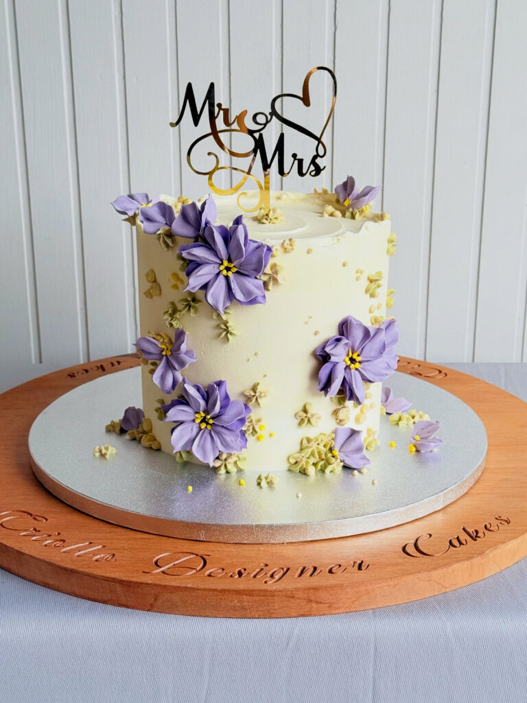 Purple Floral Two-Tier Wedding Cake Front View by Criollo Designer Cakes in Dunedin, Otago
